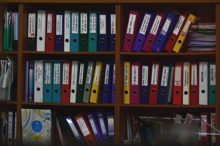 File folders on book shelves.